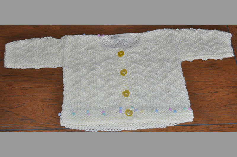 All white with small balls on bottom