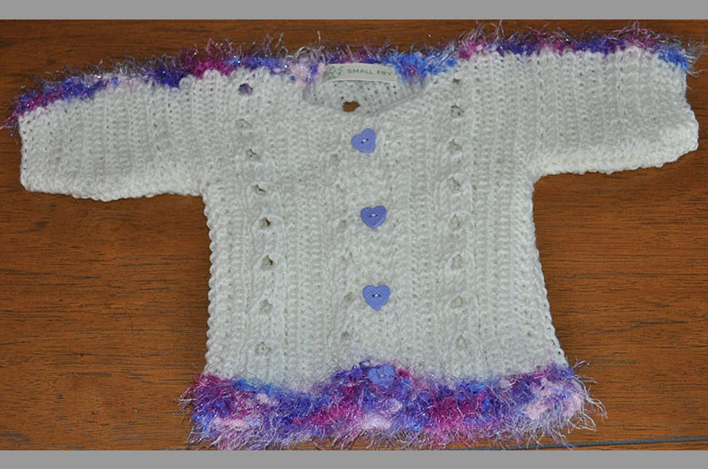 White with blue and white fringe