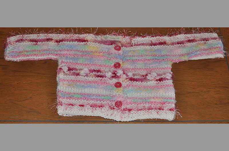 White with pink and rose fringe and multi color stripes