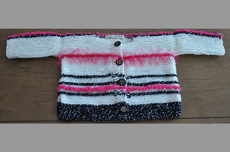 White with pink fuzzy stripes and black border