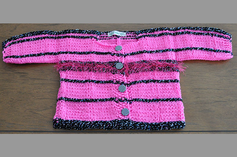 Pink with black border and fuzzy stripe in center